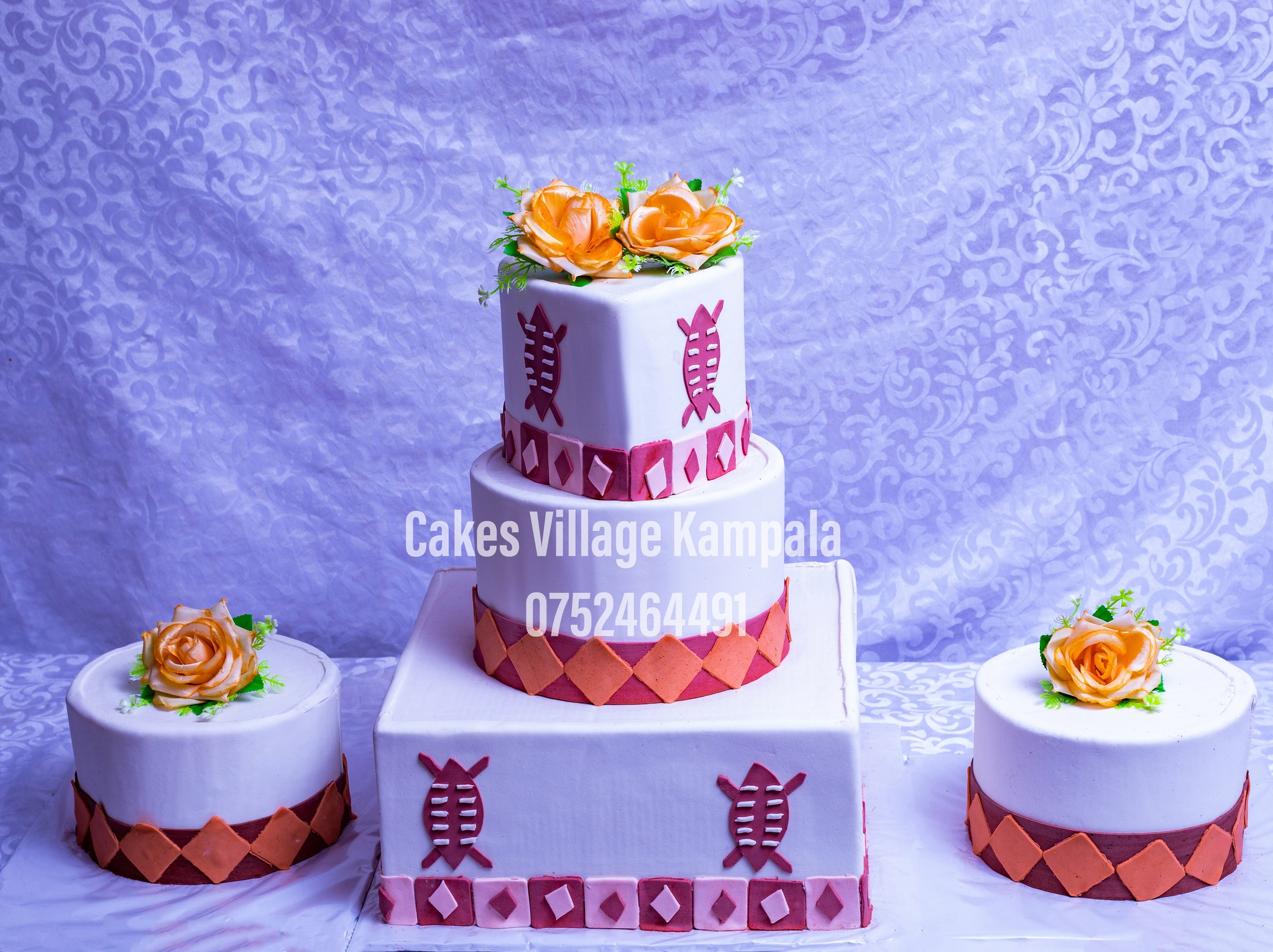 wedding cake with 4 give away cakes/side cakes