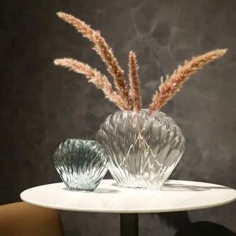 shell-shaped ceramic vases.