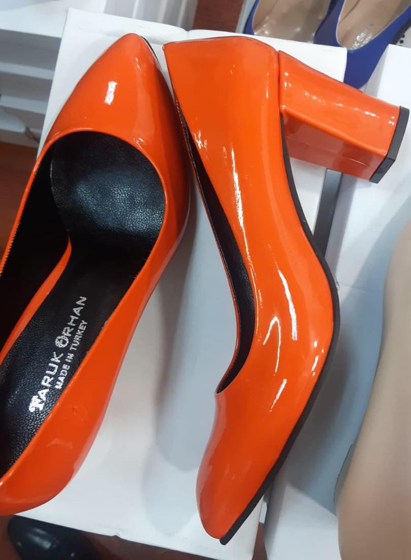 Orange block heel closed shoes