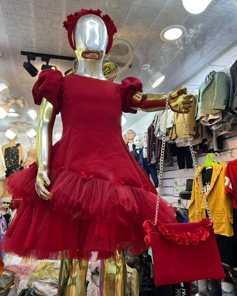 Girls deep red dress with a bag