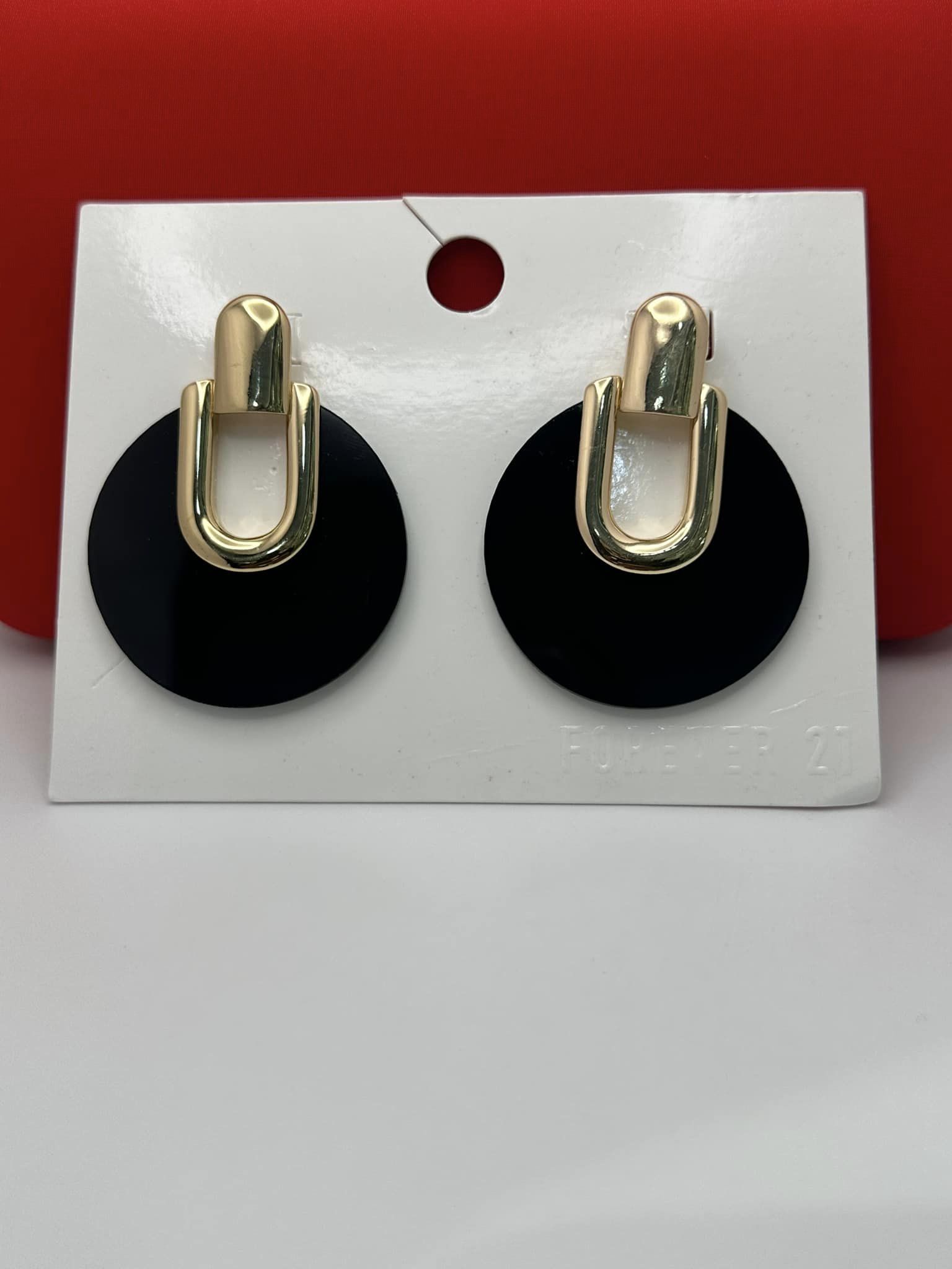 Black with gold earrings