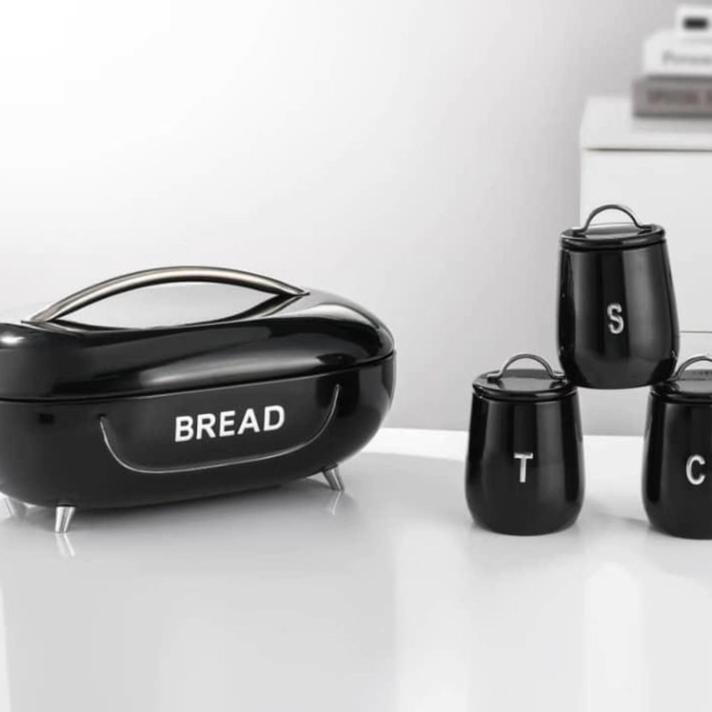metallic breadbin set with coffee,tea, sugar canisters.