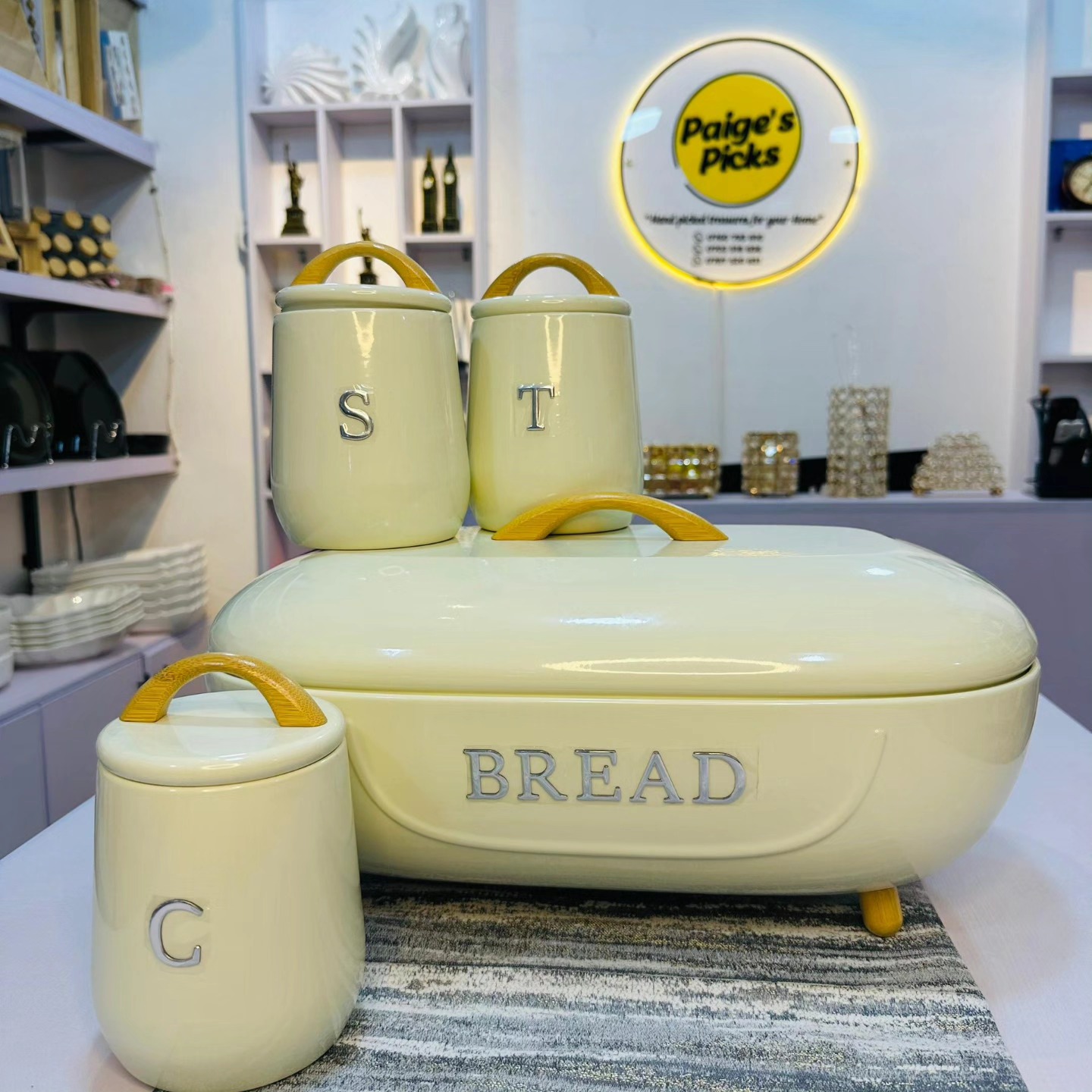 metallic breadbin set with coffee,tea, sugar canisters.